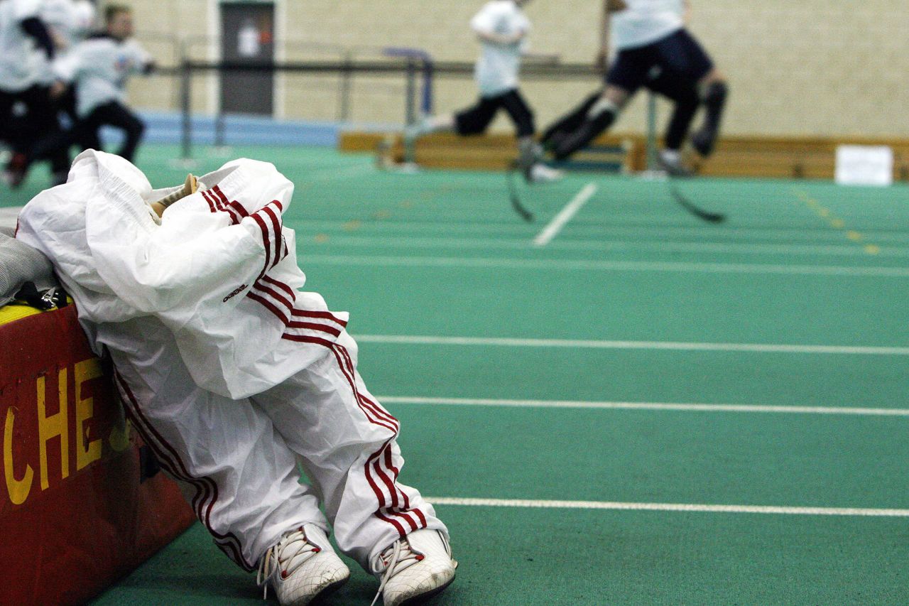 Prosthetic legs stand on the ground as Pistorius coaches children in Manchester, England, in April 2006.