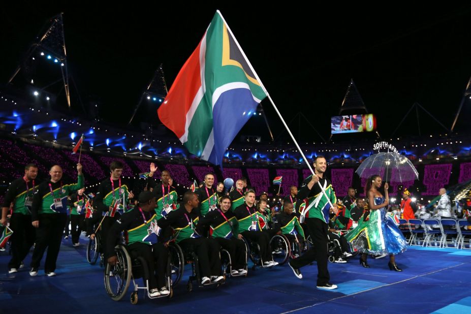 Pistorius carries the South African flag during the opening ceremony of the 2012 Paralympics in London.