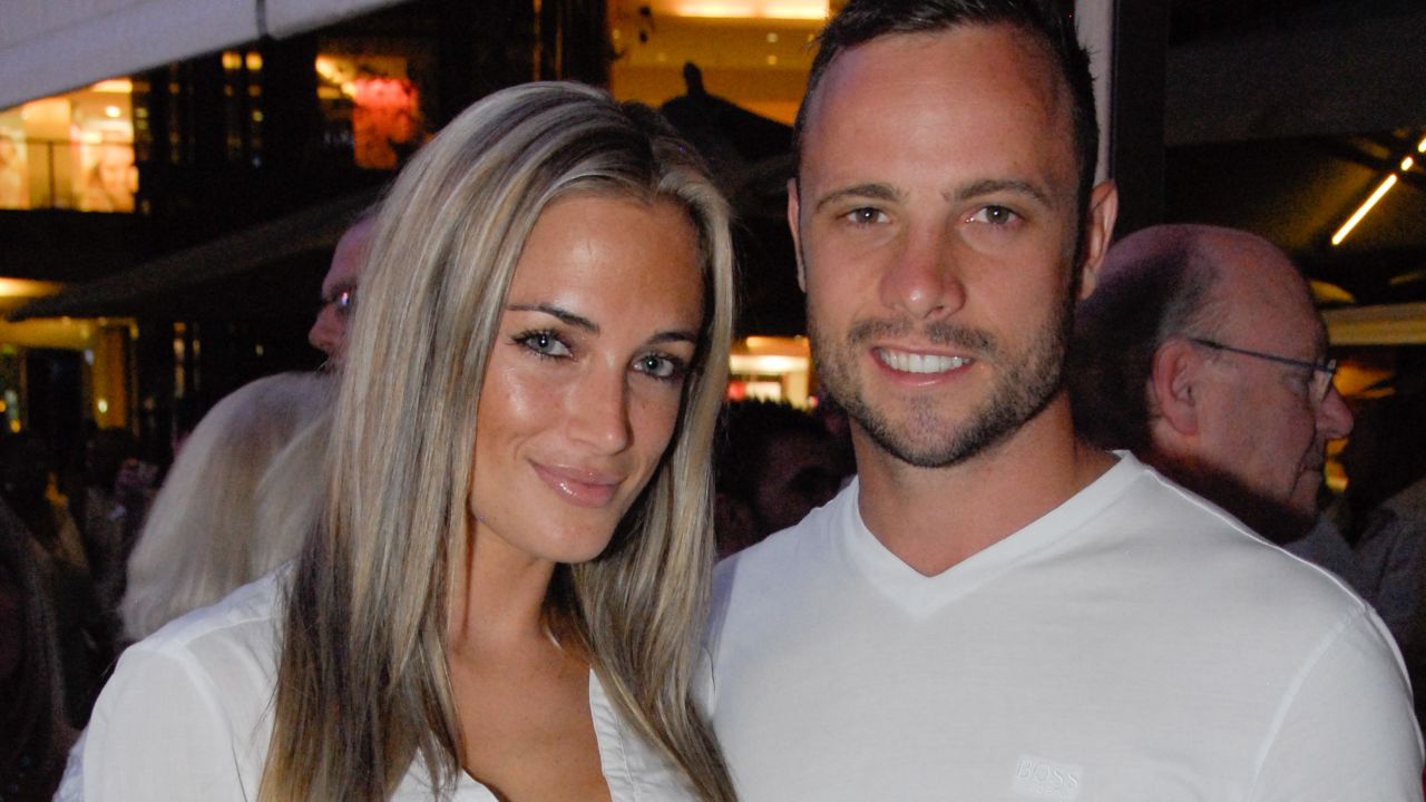 A picture taken on January 26, 2013 shows Olympian sprinter Oscar Pistorius posing next to his girlfriend  Reeva Steenkamp at Melrose Arch in Johannesburg.