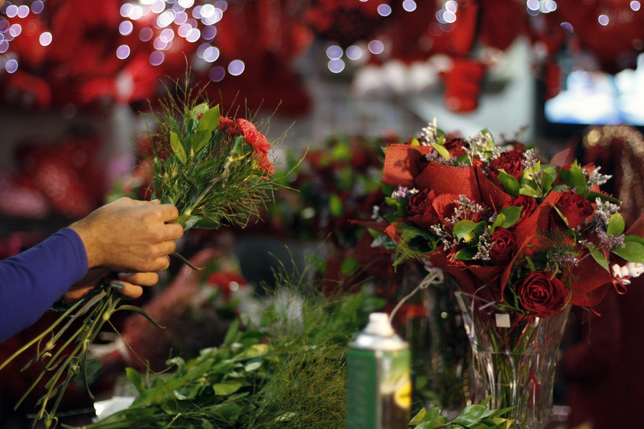 A shopkeeper prepares bouquets at a flower market in Gaza City.