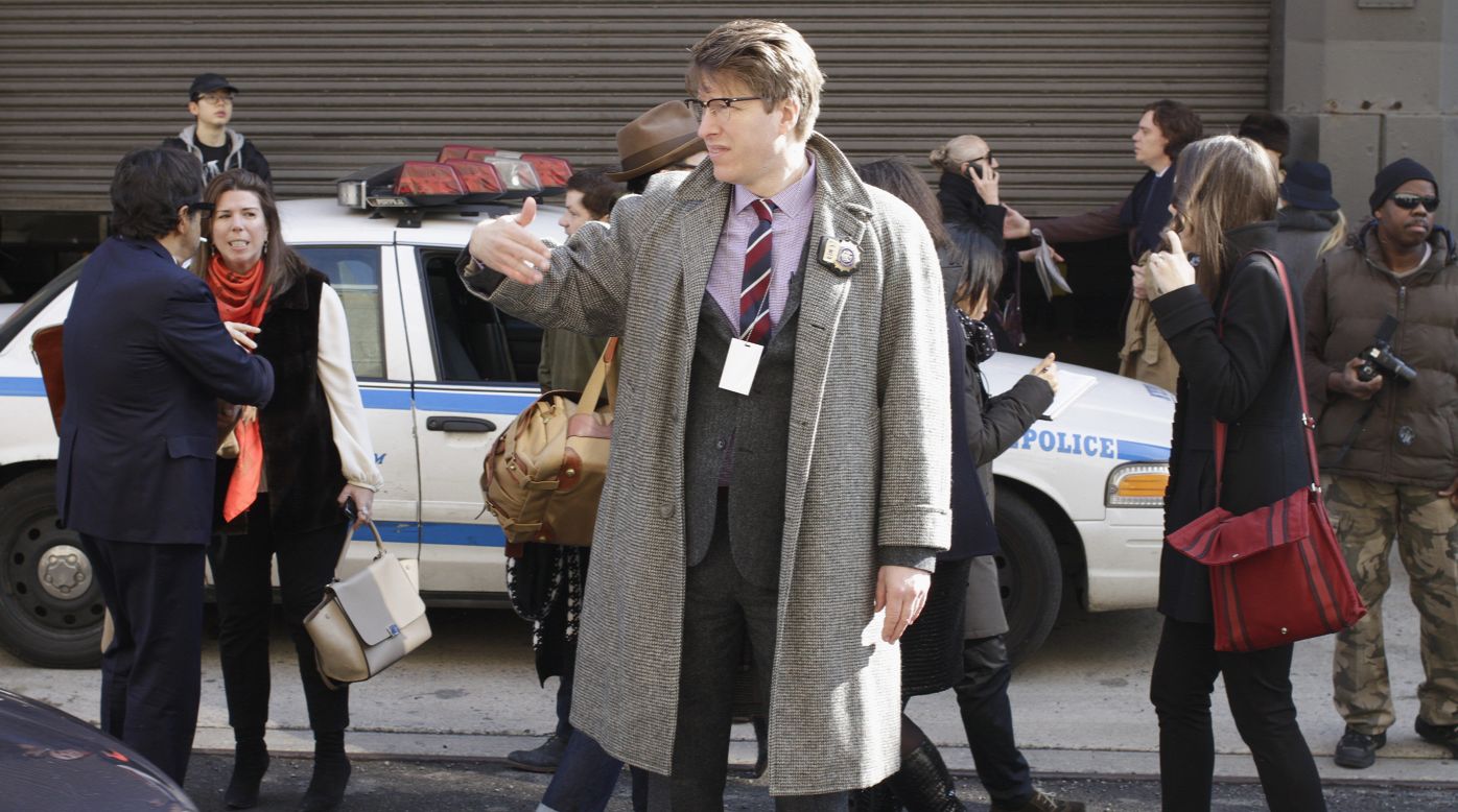 NYPD community affairs detective Rick Lee, also known as the "Hipster Cop," directs traffic.