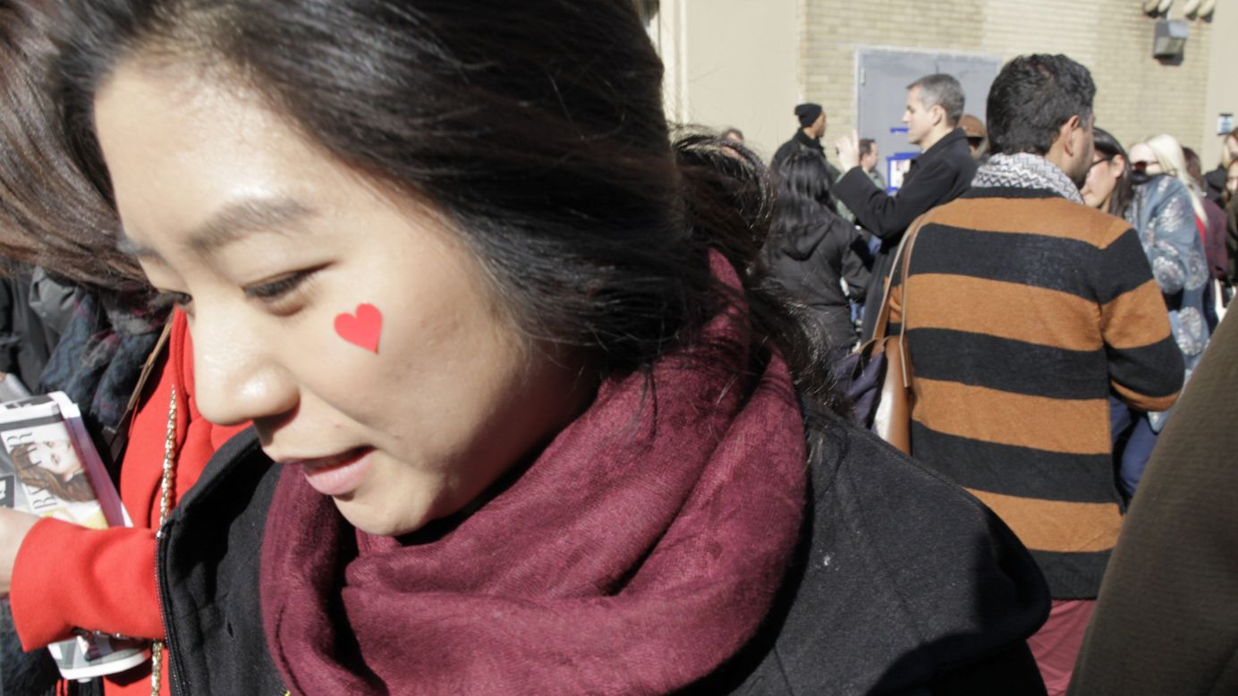 A woman shows her Valentine's Day spirit outside the Ralph Lauren show at Mercedes-Benz Fashion Week.