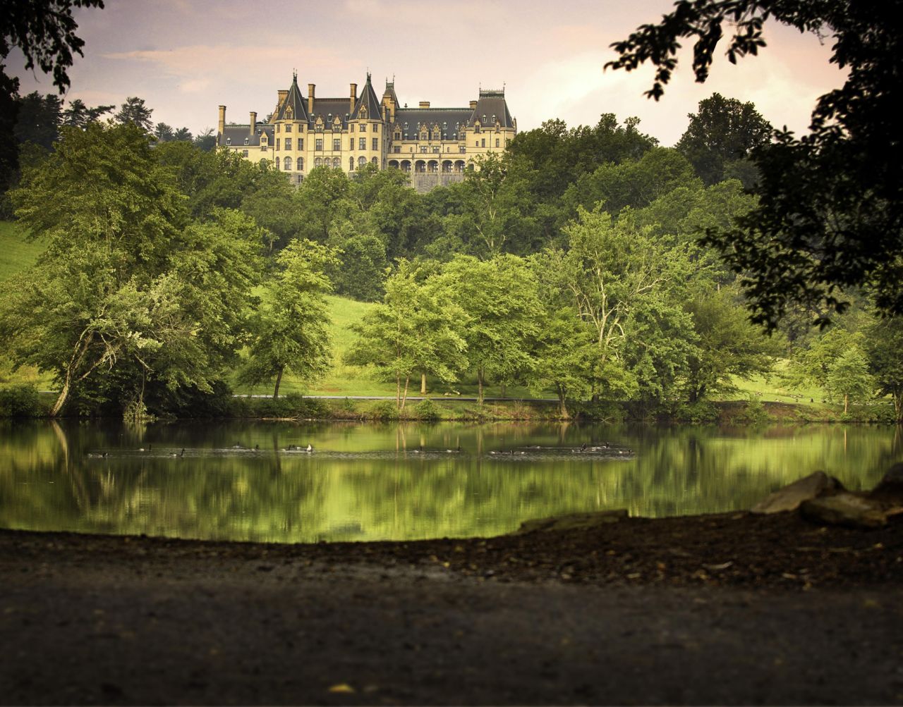 A view of the Biltmore estate from the lagoon shows the back of the house. 