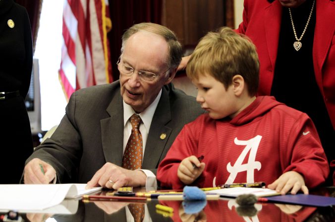 Ethan draws with Gov. Bentley in his office on Feb. 13.