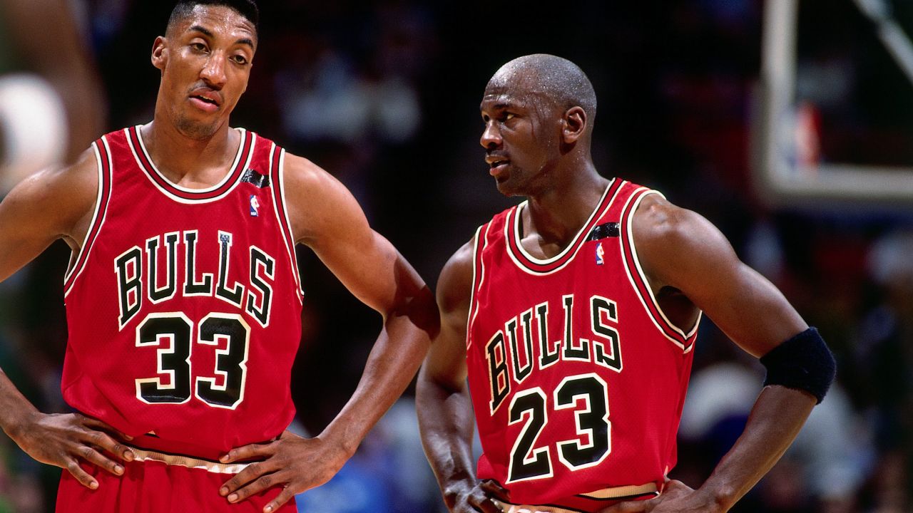 Jordan talks with teammate Scottie Pippen during a game against the Philadelphia 76ers in 1992.