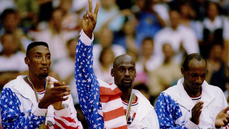Olympic Dream Team members, left to right, Scottie Pippen, Jordan, and Clyde Drexler accept their gold medals in Barcelona, Spain, in 1992.