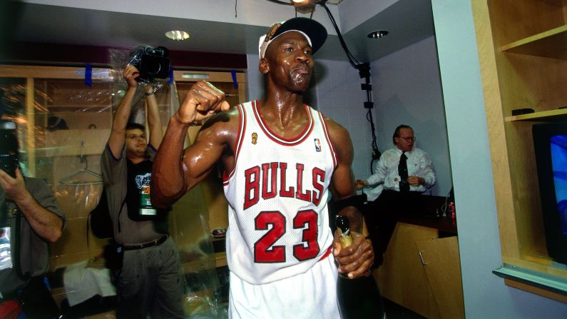 Jordan celebrates winning the NBA title after defeating the Seattle SuperSonics in Game 6 of the 1996 NBA Finals.