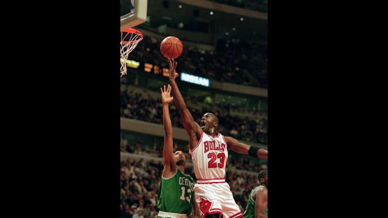 Jordan jumps to shoot the ball during a game against the Boston Celtics in 1997.