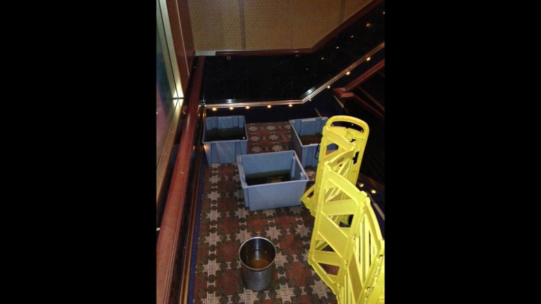 According to passenger Megan Clemons-Foxall these "buckets of sewage" rest in stairwell aboard the ship.