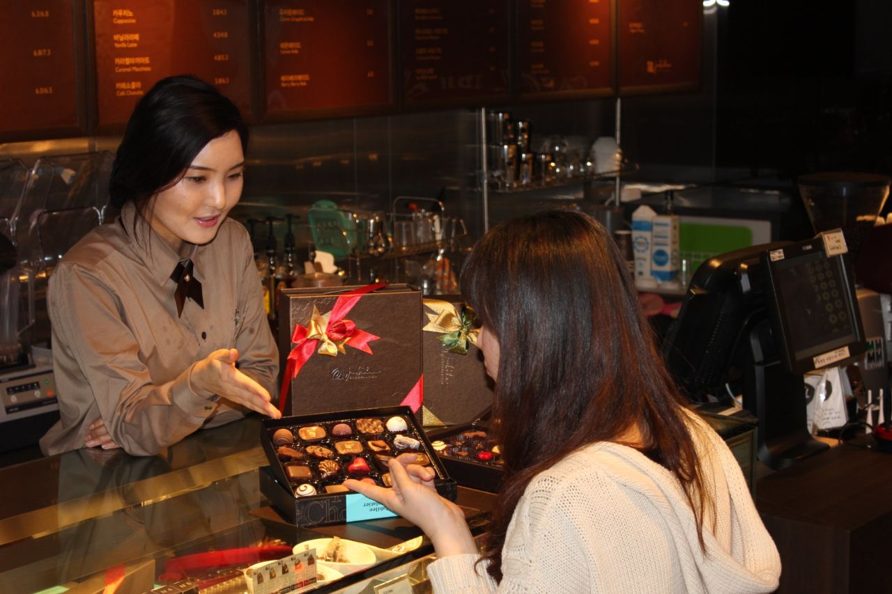 Buying handmade chocolate at Jubilee Chocolatier in Seoul. 