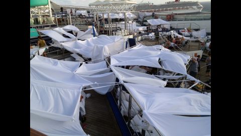 iReporter Robin Goebel says passengers dubbed an area "tent city" where many had chosen to set up temporary shelters on the deck of the disabled Carnival Triumph. Many slept on the decks of the ship because the rooms were too hot. 