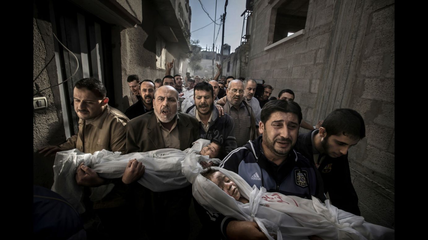 <strong>World Press Photo of the Year: </strong>Suhaib Hijazi, 2, and his brother, Muhammad, 3, were killed when an Israeli airstrike struck their Gaza City house, photographer Paul Hansen said. Their father, Fouad, was also killed, Hansen said. In the photo, Fouad's brothers carry the children's bodies to a mosque for burial on November 20, 2012, while the father's body follows behind on a stretcher. The following are a selection of the other World Press Photo winners: