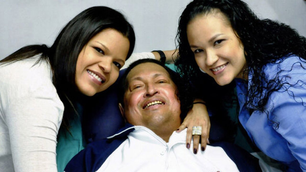 A photo from Venezuelan Information Minister Ernesto Villegas' Twitter account shows Hugo Chavez and his daughters.
