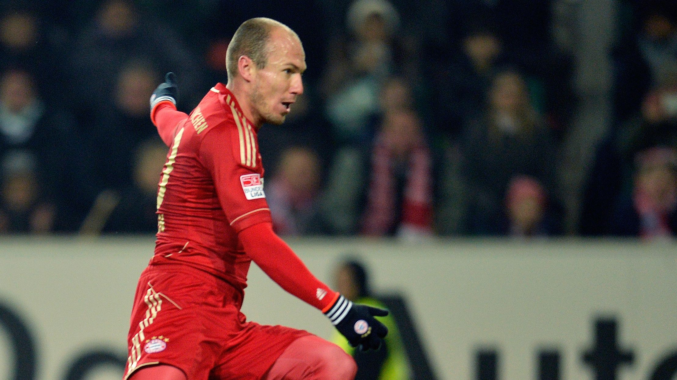 Arjen Robben fires home Bayern's second goal of the game to seal all three points at Wolfsburg.