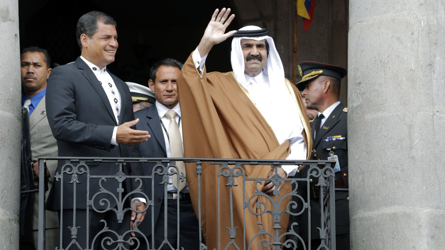 Ecuadorian President Rafael Correa hosted Qatar's Emir Hamad Bin Khalifa Al-Thani, waving, in Quito Saturday.