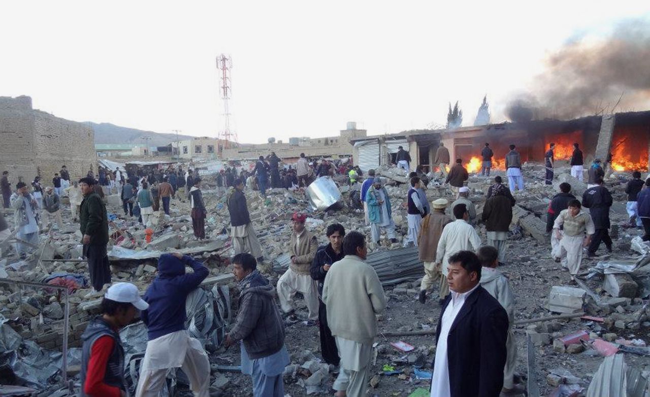 People gather after a bomb targeting Shiite Muslims exploded in a busy market in Hazara on the outskirts of Quetta, Pakistan, Saturday, February 16. A blast targeting Shiites in a busy marketplace killed at least 45 people, police told CNN.