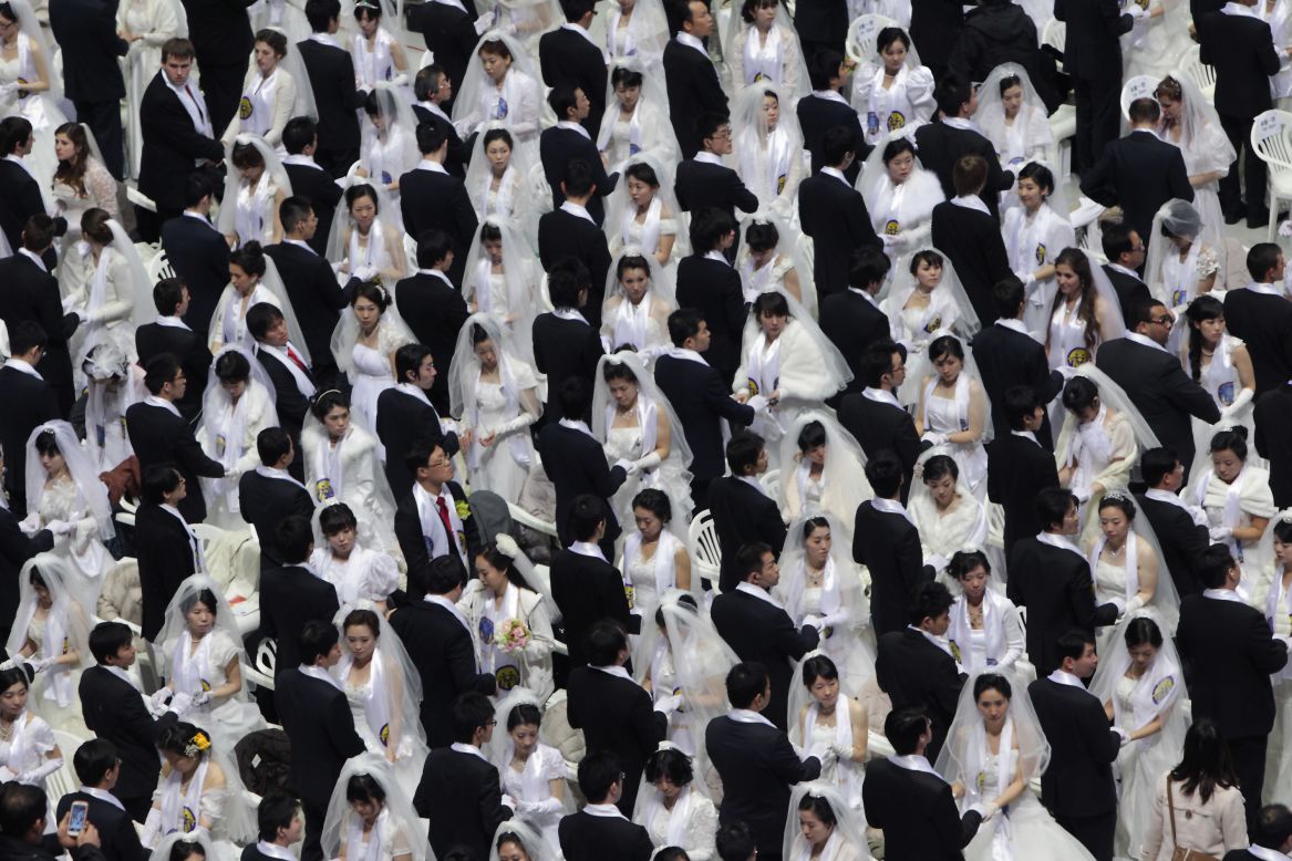 Thousands of couples take part in the Unification Church's International Mass Wedding Ceremony, also known as the Cosmic Blessing, at Cheong Shim Peace World Center in Gapyeong, South Korea, on Sunday, February 17. More than 20,000 people were expected to participate, including 1,000 couples getting married for the first time, 2,500 previously married couples, and 13,000 guests. The ceremony signifies the transcending of race and religion by creating God-centered families, according to the church, which is known for mass weddings and arranged matches.