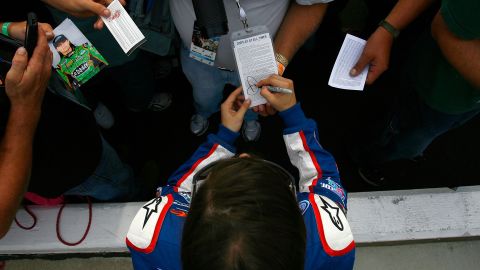 Patrick signs autographs during qualifying for the CARFAX 250 in 2010 in Brooklyn, Michigan.