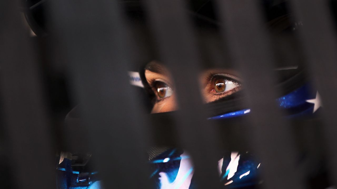 Patrick sits in her car in the garage area during practice for the VFW Sport Clips Help a Hero 200 in 2012 in Darlington, South Carolina.