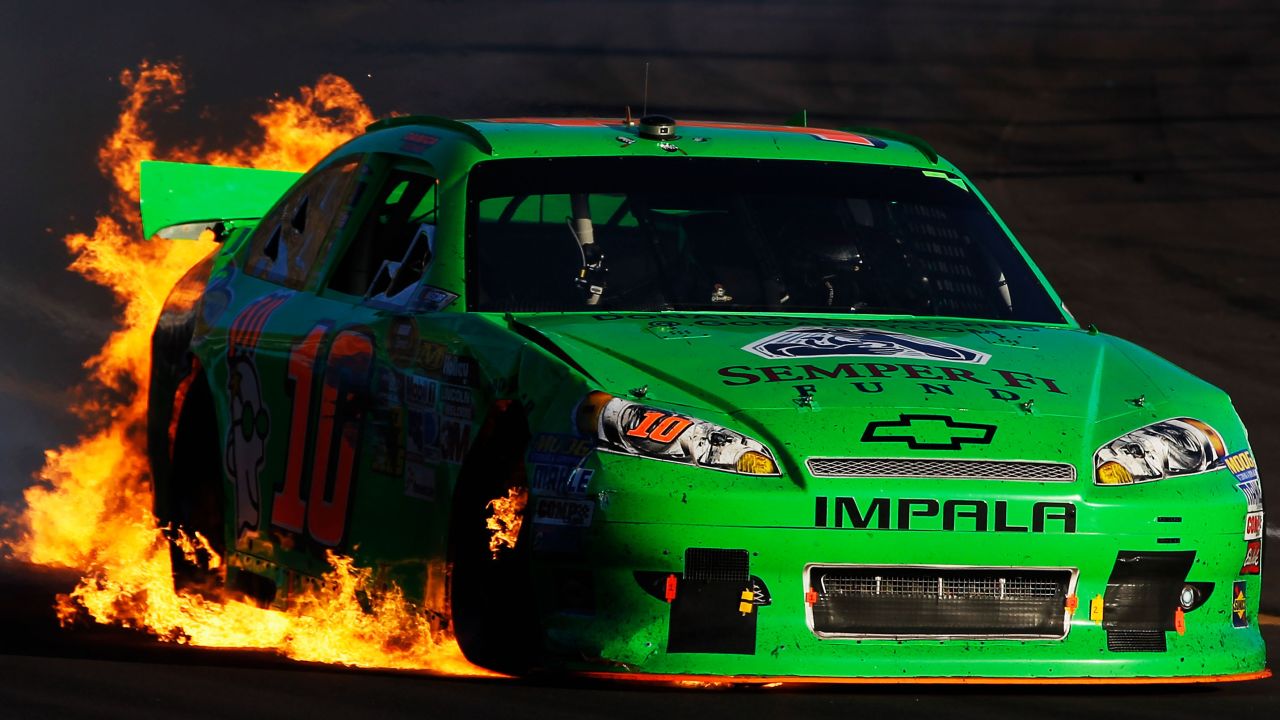 Patrick drives as flames shoot from the back of her car after an incident in the AdvoCare 500 in 2012 in Avondale, Arizona.