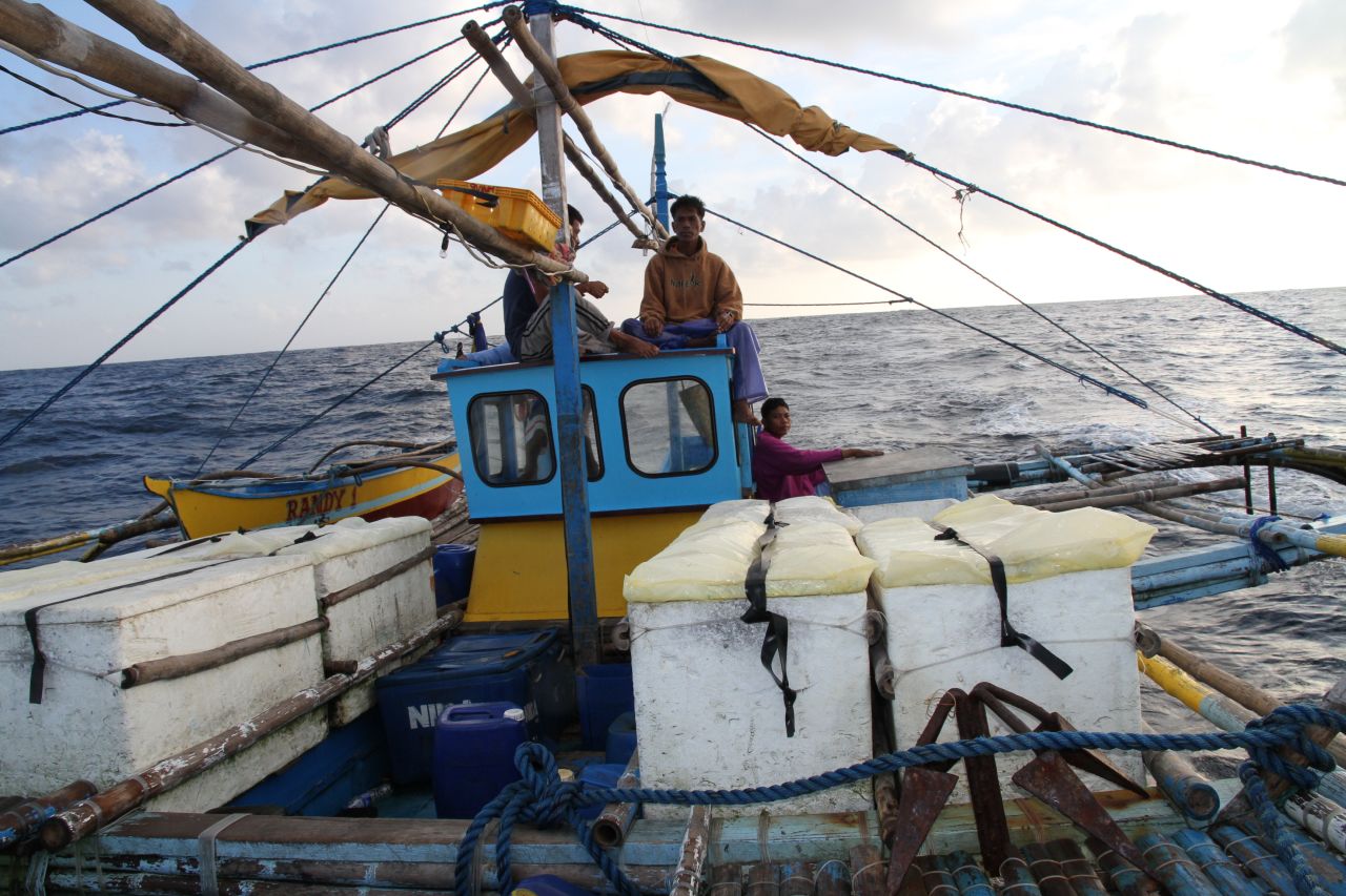 Efren Forones (center) and his fellow fishermen embark on the 38-hour trip to fishing grounds around the disputed Scarborough Shoal.