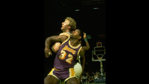 After the Lakers' first championship under Buss, either the Lakers or Boston Celtics played in the next four championship series. The Celtics won the 1984 championship in seven games, reigniting a storied rivalry between the two teams that had waned after the championship contests of the 1960s. Pictured, "Magic" Johnson and the Boston Celtics' Larry Bird in the NBA Finals in 1984.
