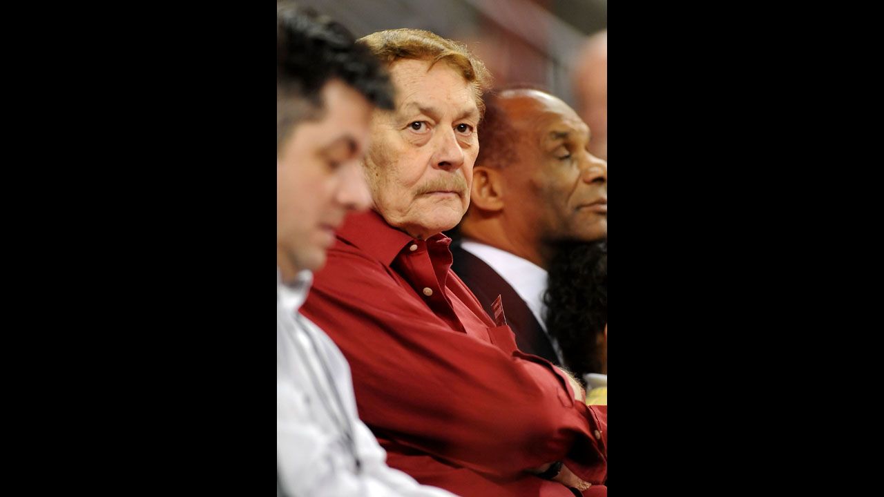 After finishing his chemistry degree from the University of Wyoming in 2½ years, Buss went on to receive his master's in chemistry at the University of Southern California and completed his doctorate by age 24. Pictured, Buss watches USC play Arizona State in 2009 in Los Angeles.