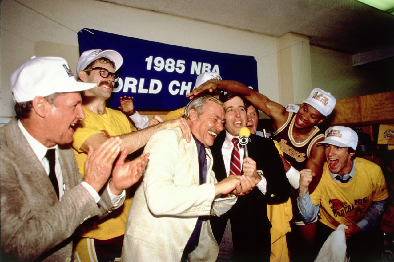 The Lakers took back the title from the Celtics in 1985. During the series, Larry Bird averaged 26 points and nine rebounds to Johnson's 18 points and 15 assists. The series marked the pinnacle of a rivalry that helped boost the NBA's attendance and television ratings. Pictured, Buss and his team celebrate winning the 1985 Finals.