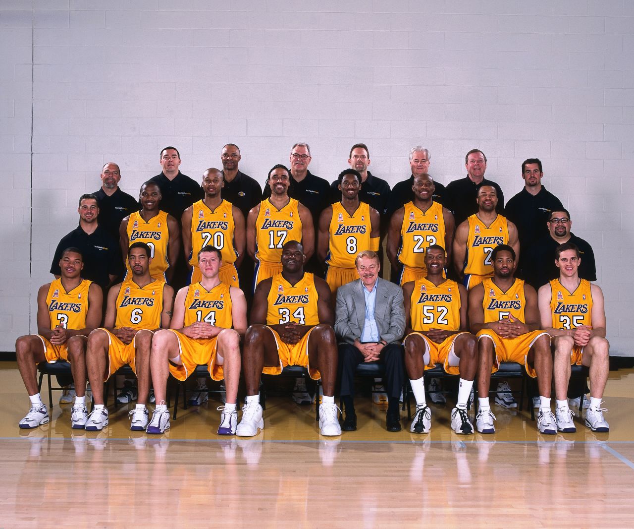Not only did Buss' Lakers win their third-straight championship, but his Sparks racked up their second consecutive title. Pictured, the Lakers' team portrait in 2002.