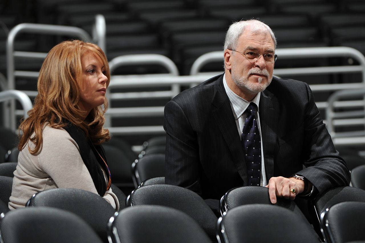 Daughter Jeanie Buss, executive vice president of business operations for the Lakers, got engaged to Lakers' head coach Phil Jackson, the architect of five of the team's championships, in 2012. Pictured, the two watch a game together in 2007.