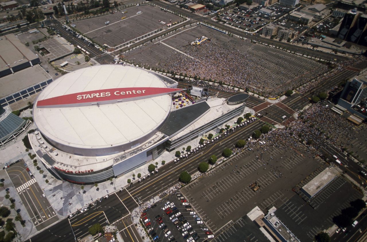 The Lakers and Sparks moved into the $375 million Staples Center in downtown Los Angeles in 1999. Pictured, Lakers fans crowd the center during the Lakers' NBA championship parade in June 2001.