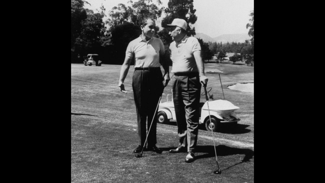 President Richard Nixon and Attorney General John Mitchell play golf at the Los Angeles Country Club in 1969.