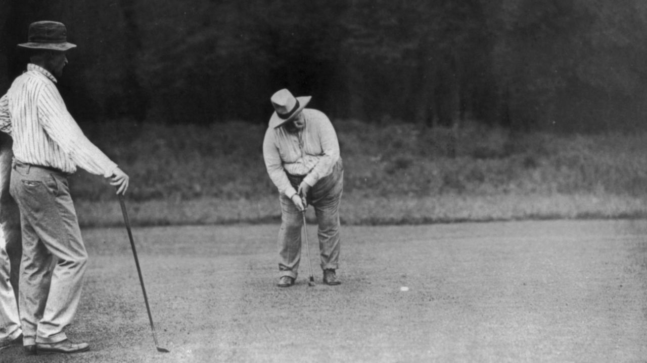 President William Howard Taft, the 27th U.S. president, putts on the green in Chevy Chase, Maryland, on June 28, 1909. He is said to be the first presidential golfer.