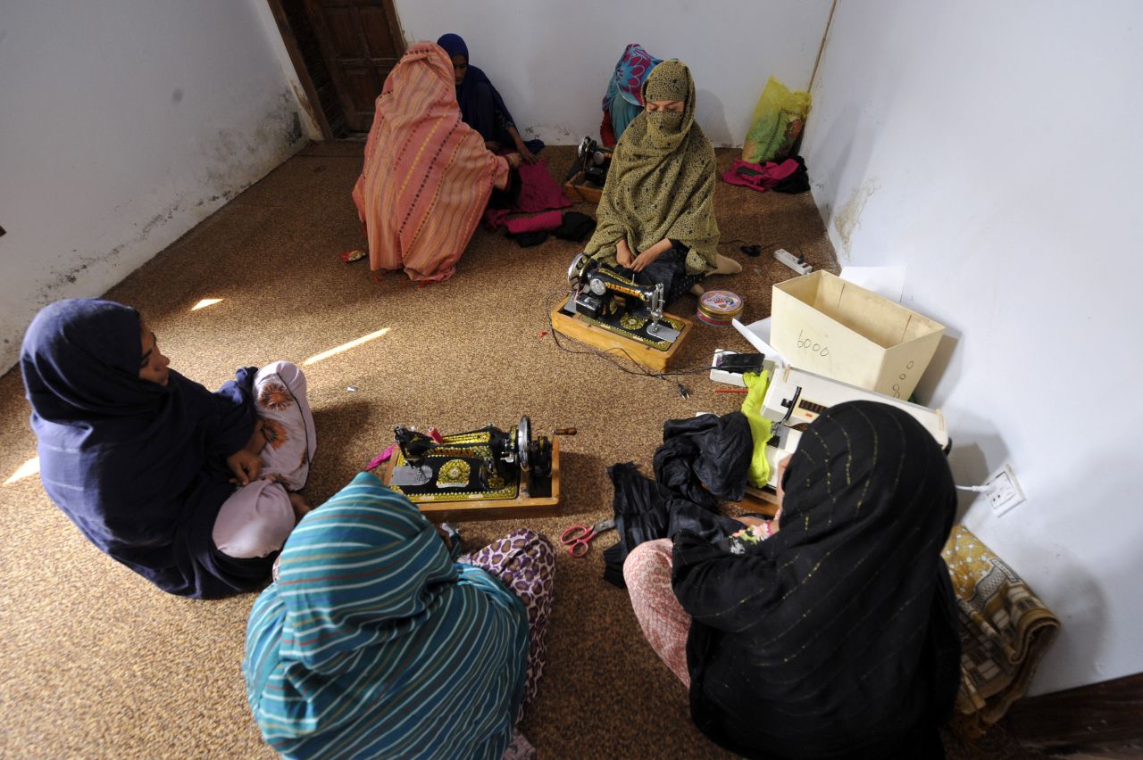 This photograph taken on February 28, 2011, shows women sitting at a vocational training center for women in a shelter set up by Mukhtar Mai to protect women in the village of Mirwala in Pakistan's central Punjab province. 