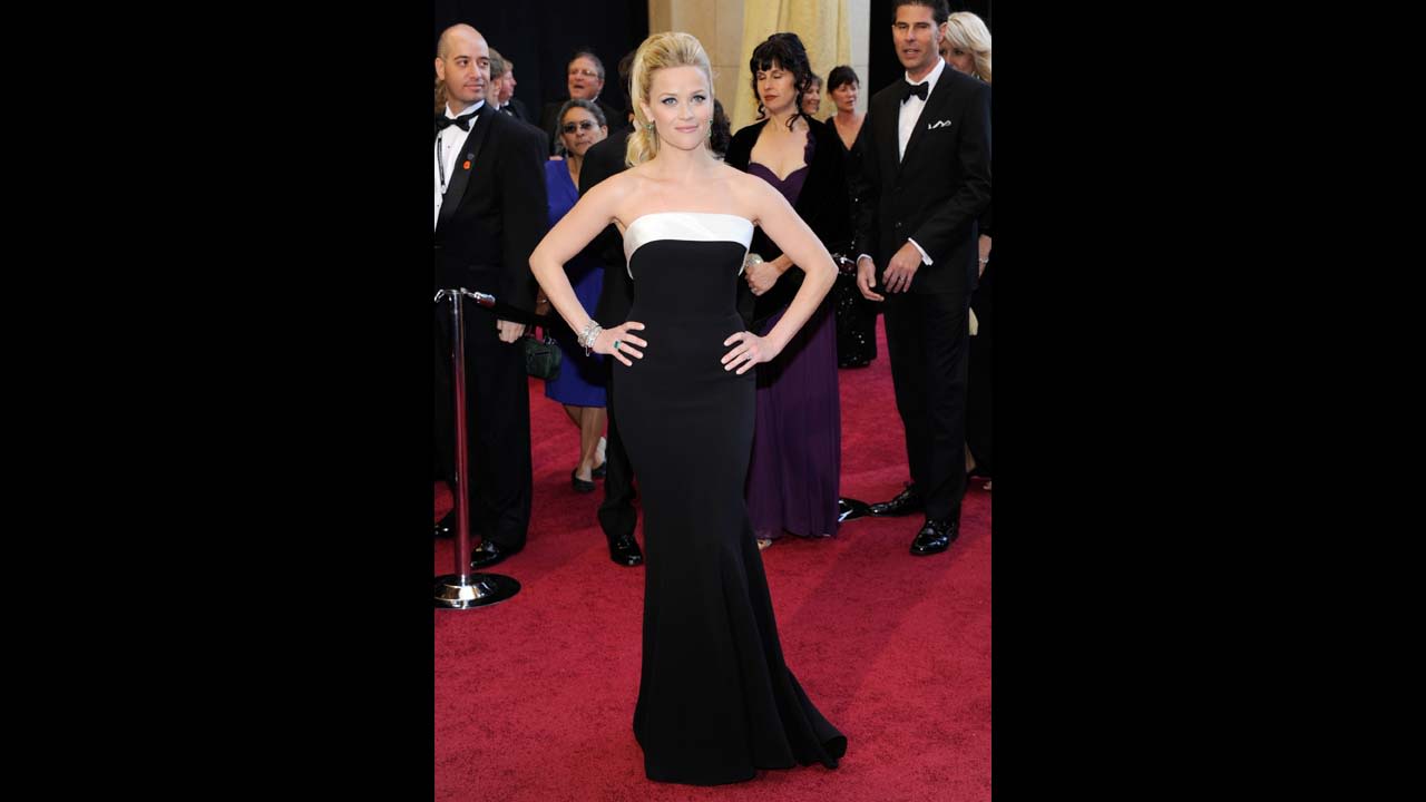 Reese Witherspoon wore another iconic black-and-white gown in 2011. She paired the Giorgio Armani Prive dress with Neil Lane jewels and a glamorous ponytail.