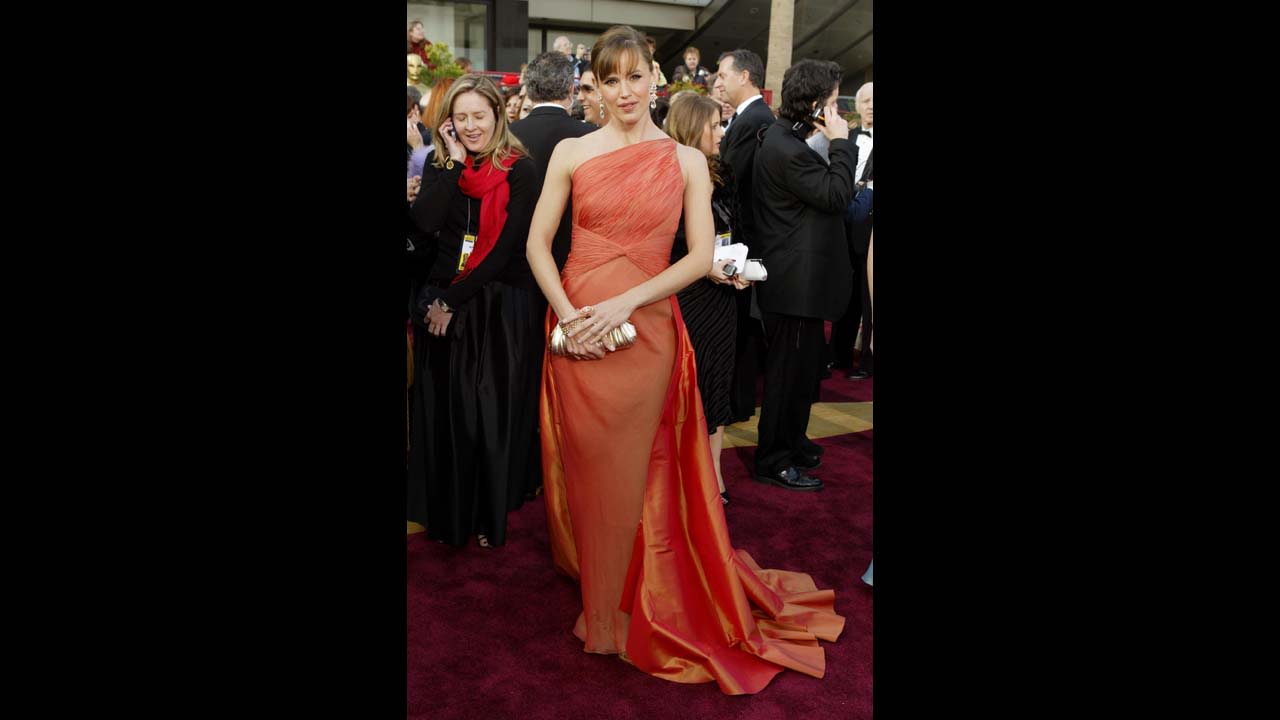 Jennifer Garner wore a memorable tangerine gown at the 2004 Academy Awards. "Jennifer is so comfortable in her own skin, she can wear a gown this complex," designer Valentino said.