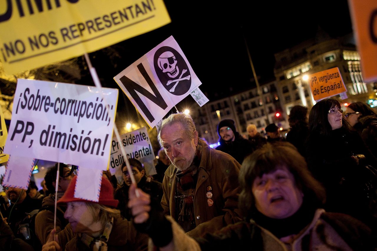 Protestors gather during a demonstration against alleged corruption scandals implicating the PP (Popular Party) on February 3 in Madrid, Spain.