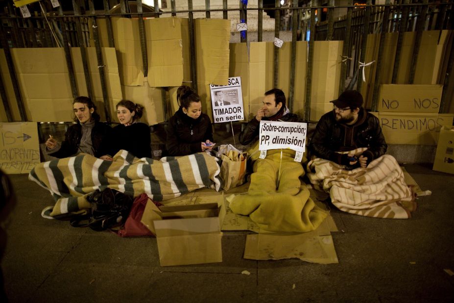 Demonstrators camp at a protest in Puerta del Sol Square after a demonstration against alleged corruption scandals implicating the PP (Popular Party) on February 3 in Madrid, Spain.