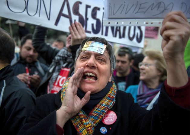 People protest against the Spanish laws on house evictions outside the Spanish parliament on February 12 in Madrid, Spain.