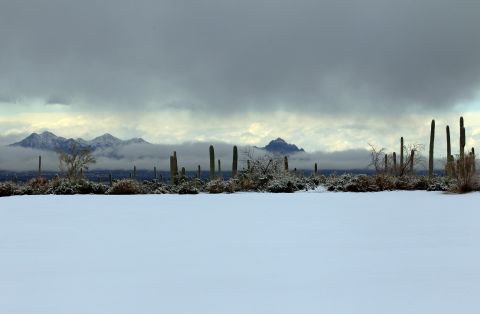 Snow covers the driving range at Dove Mountain on Wednesday.