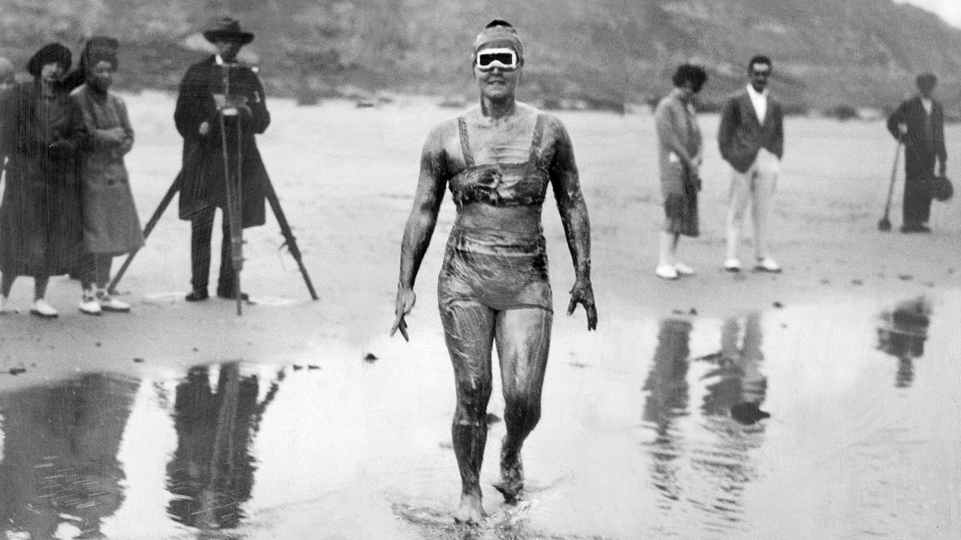 Gertrude Ederle wades into the water on her way to becoming the first woman to swim the English Channel, which she did in 14 hours and 31 minutes, breaking the previous men's record.