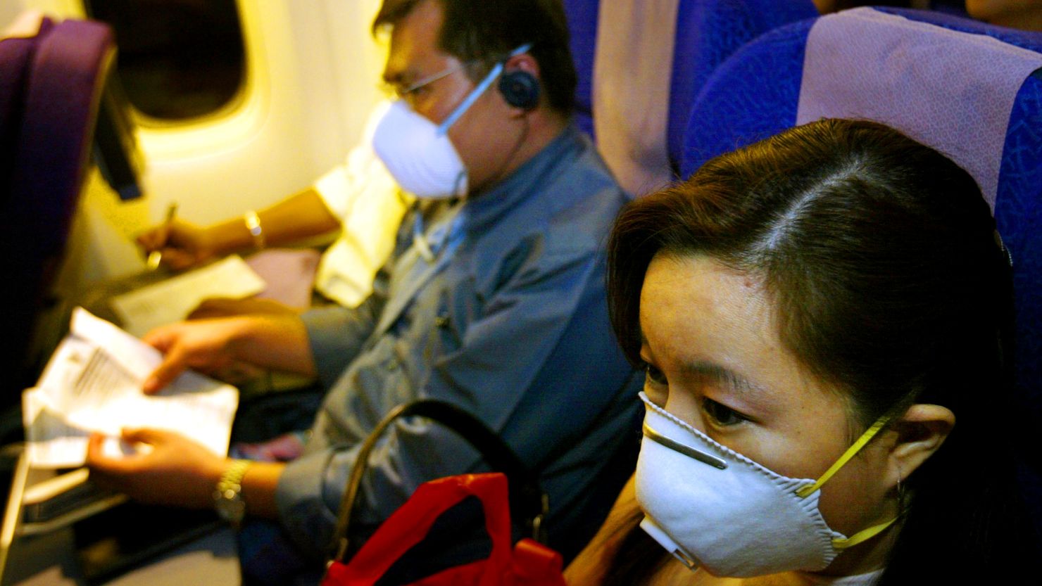 Passengers wear masks during the SARS outbreak in 2003.