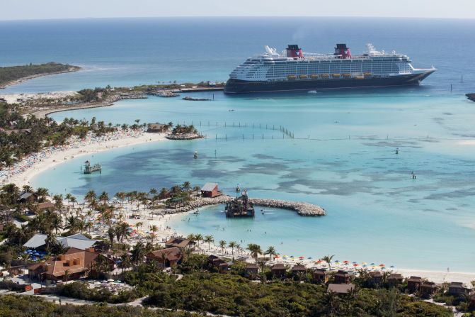 The Disney Dream is shown arriving at Castaway Cay, Disney's private island in the Bahamas.
