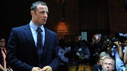 South African Olympic sprinter Oscar Pistorius appears at the Magistrate Court in Pretoria on February 22, 2013. Pistorius battled to secure bail as he appeared on charges of murdering his model girlfriend Reeva Steenkamp on February 14, Valentine's Day. South African prosecutors will argue that Pistorius is guilty of premeditated murder in Steenkamp's death, a charge which could carry a life sentence. Pistorius denies the charge, saying that he shot 29-year-old Steenkamp repeatedly through a locked bathroom door in the dead of night by accident, having mistaken her for a burglar. AFP PHOTO / ALEXANDER JOE        (Photo credit should read ALEXANDER JOE/AFP/Getty Images)