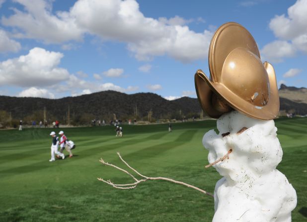 "Frosty the Snowman" keeps cool while the players get back to work in Arizona. Frosty is modeling a new hat too.