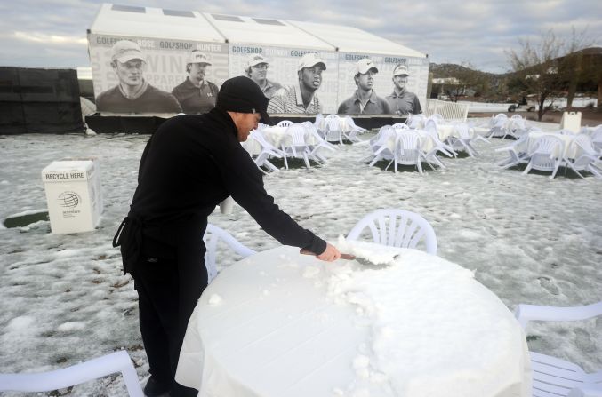 It's not just on the course where the snow caused havoc. Organizers were forced to get their scrapers out to make sure fans could sit down and enjoy a drink or two.