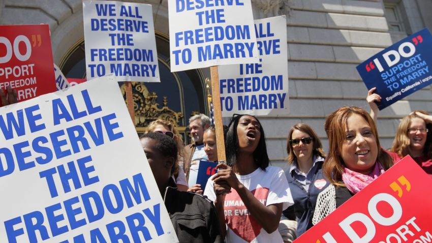 SAN FRANCISCO - AUGUST 12: Supporters of same-sex marriage hold signs and cheer after a stay was lifted that allows same-sex couples to marry in California August 12, 2010 in San Francisco, California. California Supreme court Judge Vaughn Walker lifted a stay on same-sex marriages in California just over one week after his ruling that Prop