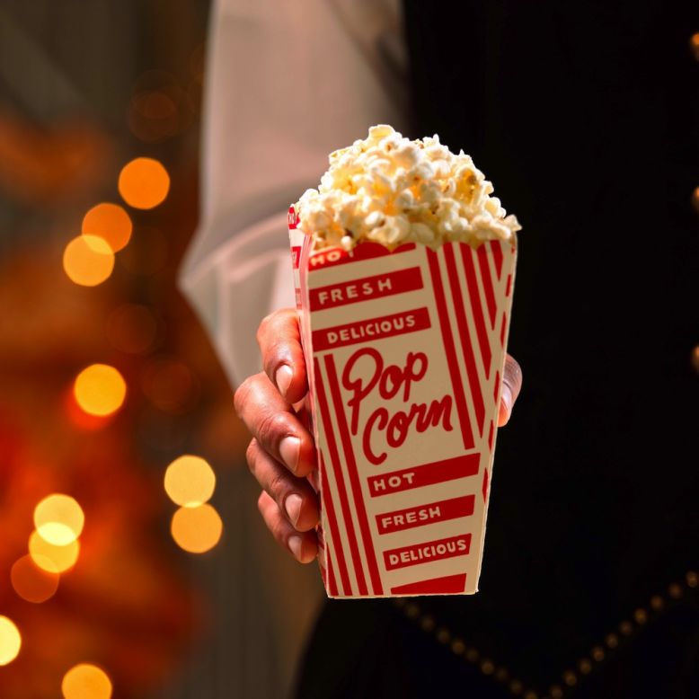 <strong>Best popcorn: Small with no toppings or real butter </strong><br />Choose the smallest size popcorn available, says Kriegler, and go easy on the salt and toppings. <br /><br />Even with a small, you'll likely want to split it with a friend. Regal, the country's largest theater chain, reports that their small popcorn contains 670 calories and 34 grams of saturated fat. AMC, the No. 2 chain, serves a smaller option: 370 calories, but still a day's worth of saturated fat (20 grams). <br /><br />Cinemark Theaters, the third largest chain, is your best bet when it comes to popcorn: Their kernels are popped in non-hydrogenated canola oil, which is much lower in saturated fat than its rivals' choice of coconut oil, and is offered in a Junior Bag for only 200 calories, 11 grams fat and only 1 gram saturated fat.