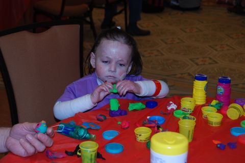 Rafi Kopelan keeps busy with her Play-Doh, July 2012.