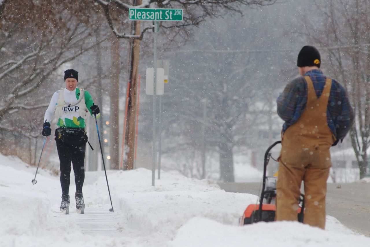 Shawn Noble skis to work after a winter storm left more than 6 inches of snow on February 22 in Iowa City, Iowa.
